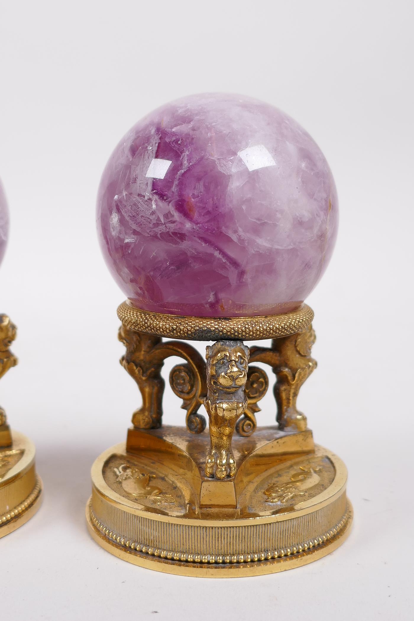 A pair of ormolu stands with lion supports, inset with crystal balls, 4" high - Image 4 of 4