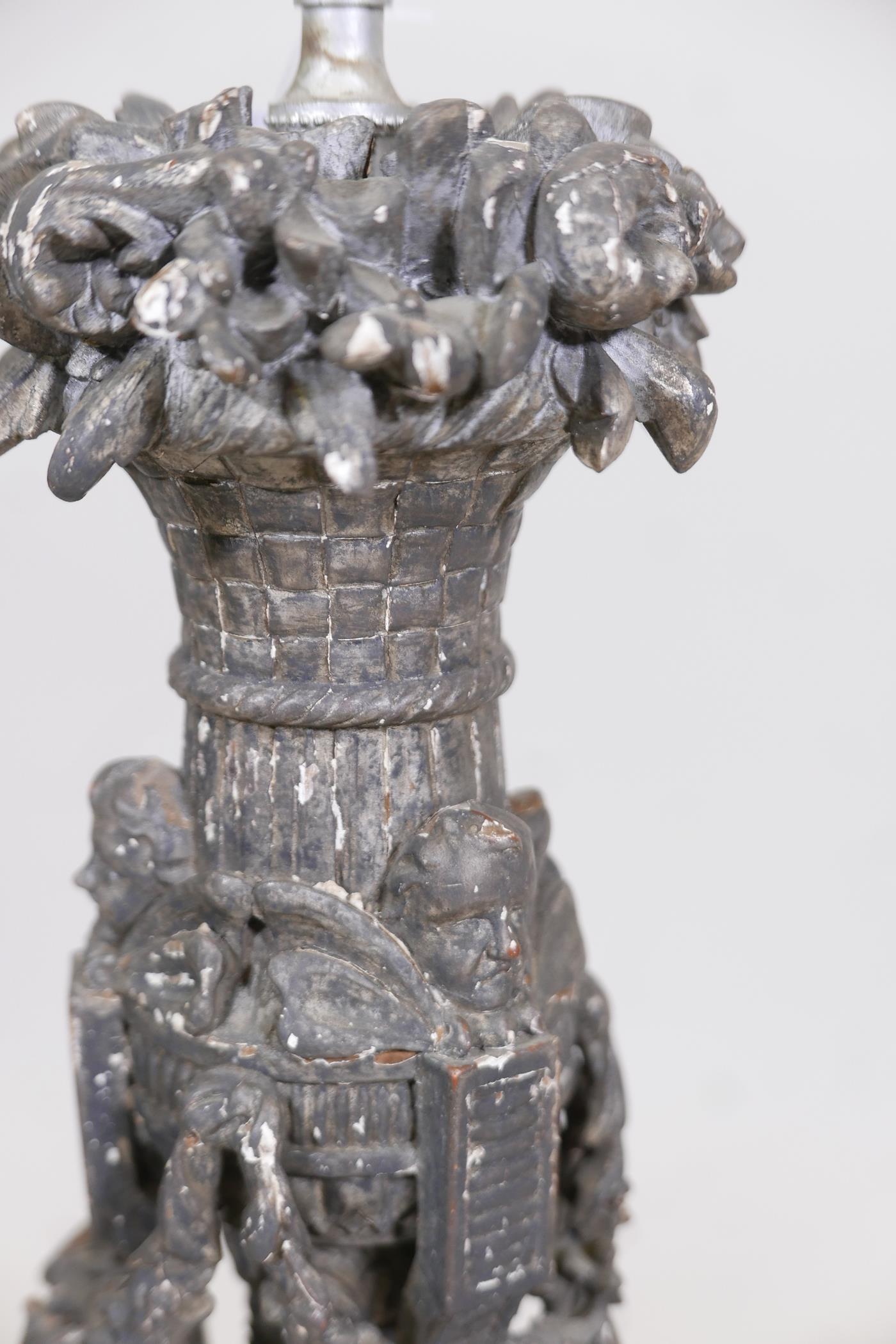 A C19th wood table lamp, well carved with floral swags and winged putti, drilled for electricity, - Image 2 of 4