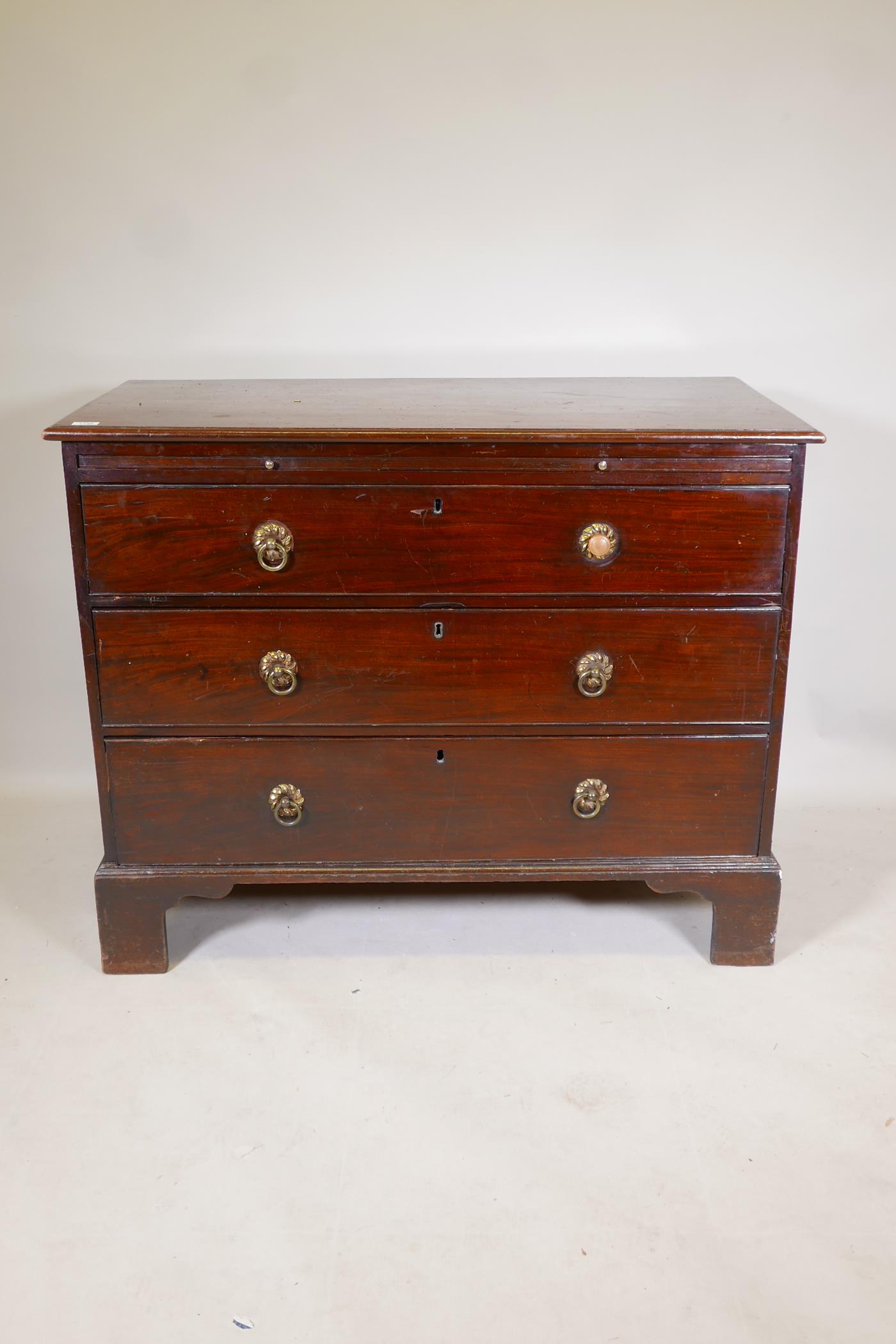 A C19th mahogany chest of three long drawers, under a brushing slide, raised on bracket supports, - Image 2 of 6