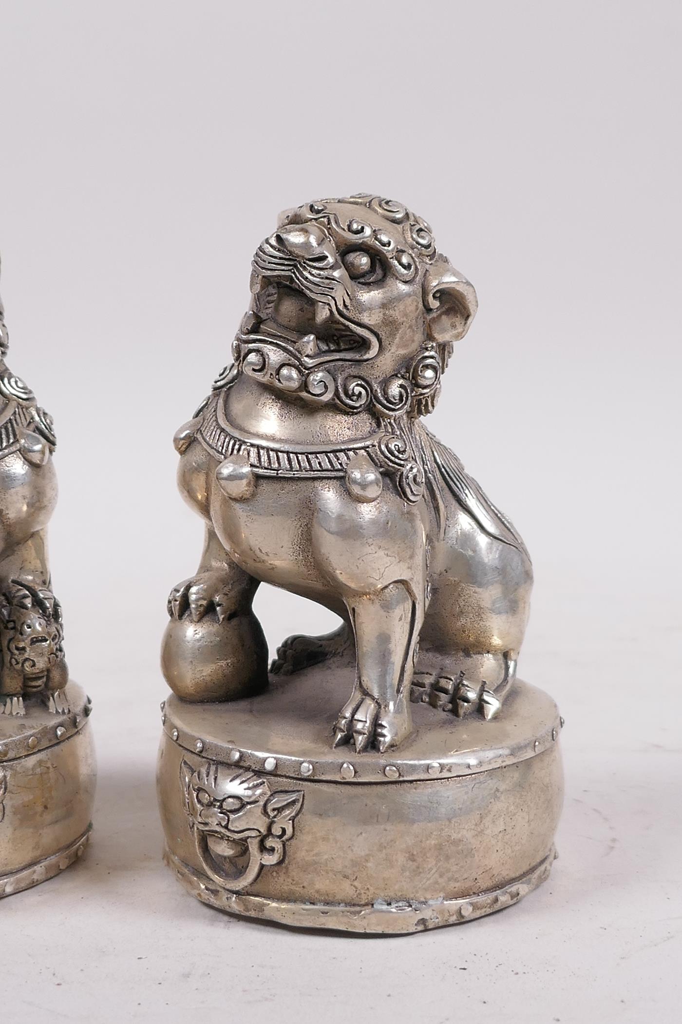 A pair of Chinese filled white metal fo dogs, 4 character mark to base, 4½" high - Image 2 of 4