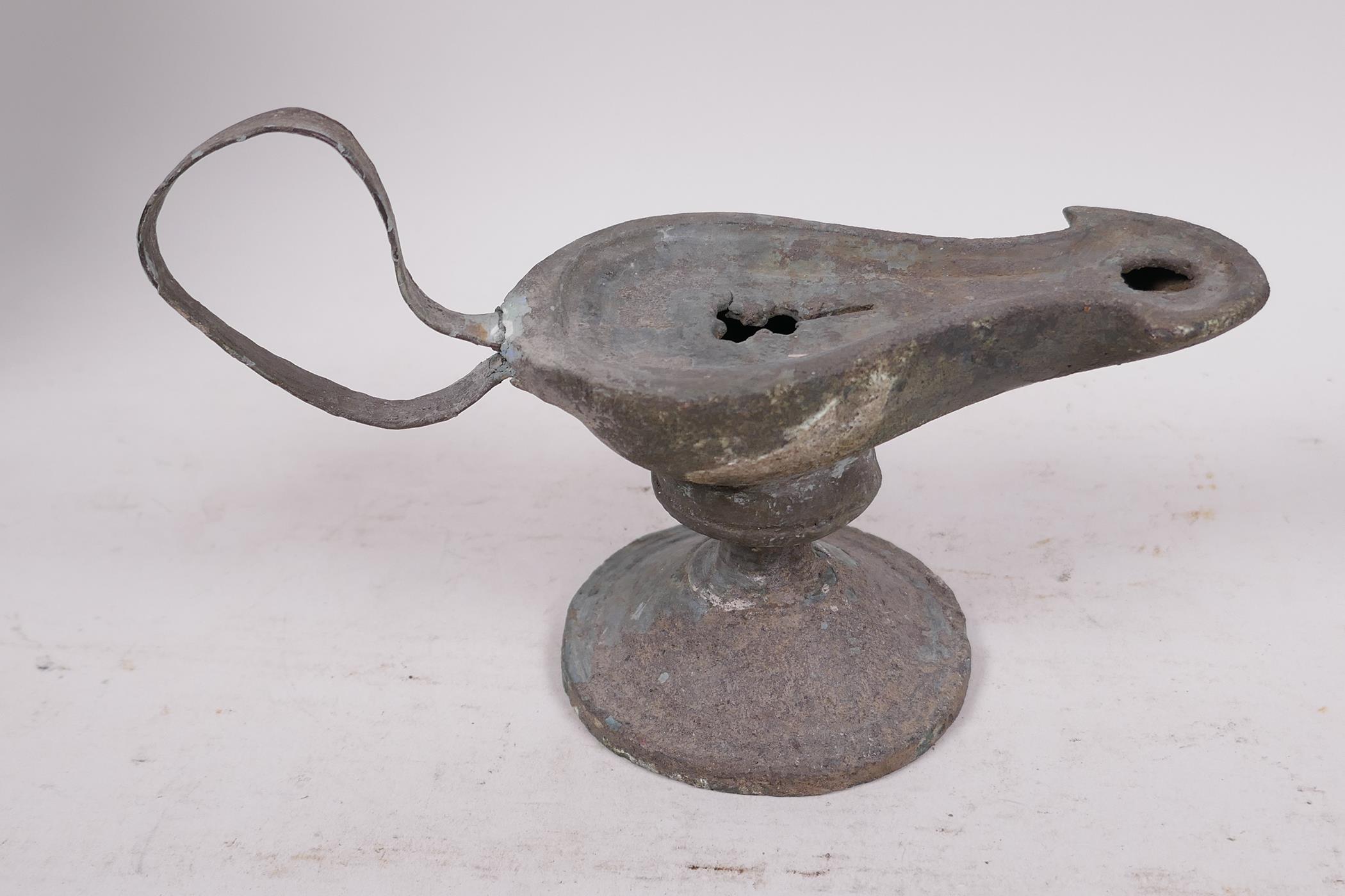 A Roman bronze oil lamp on pedestal base, 7" long - Image 3 of 4