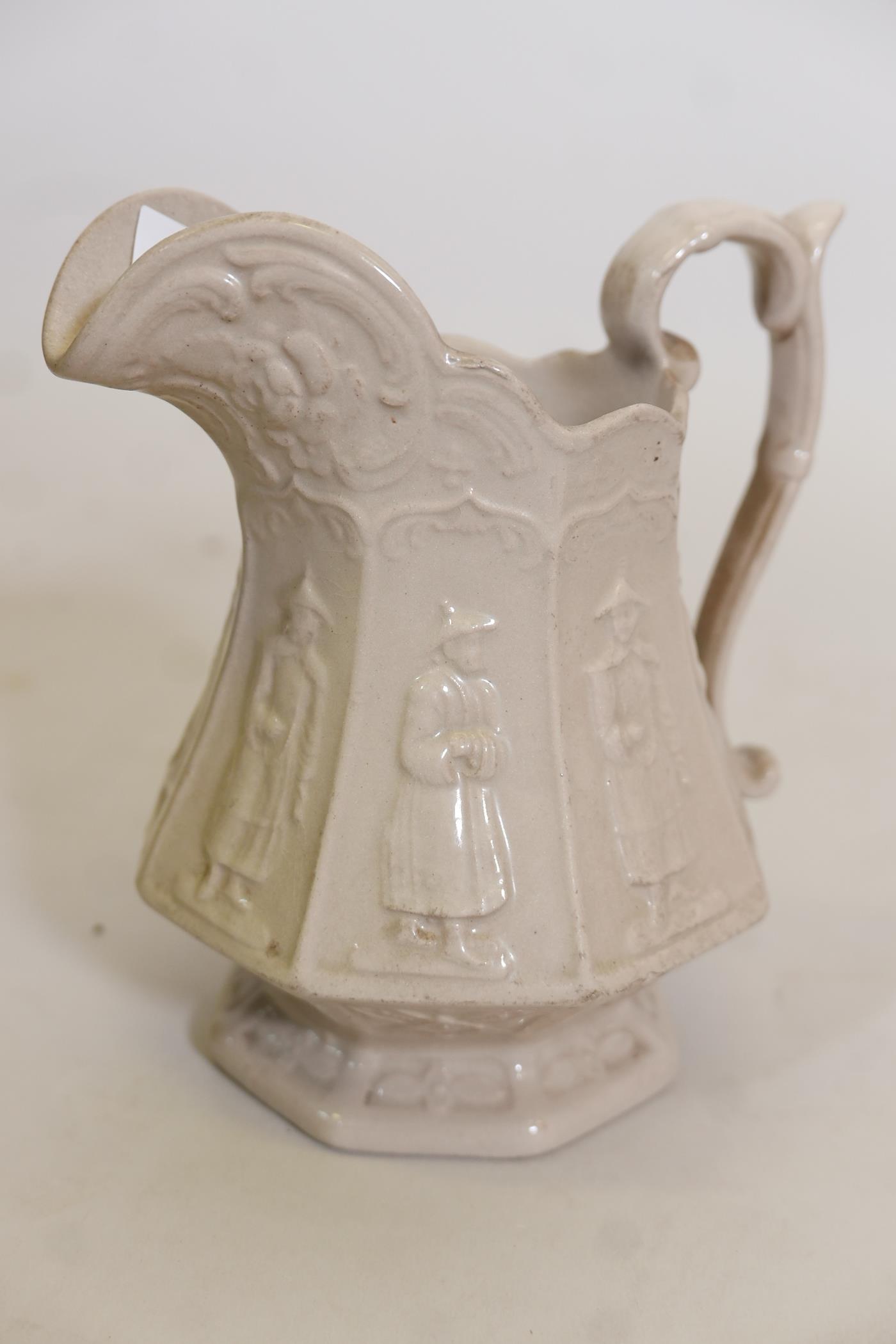 An early C19th Staffordshire buff glazed jug with raised panel decoration of Chinamen, unmarked, - Image 2 of 4
