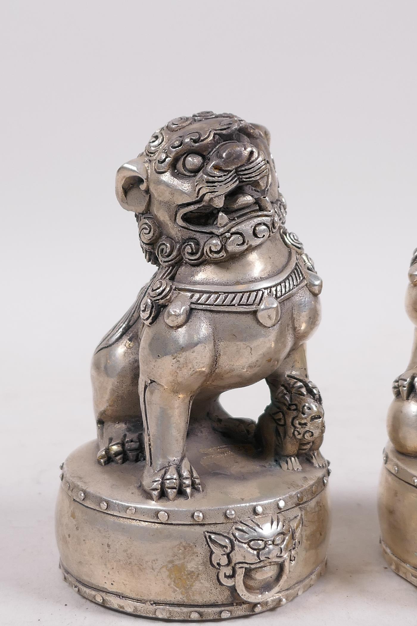 A pair of Chinese filled white metal fo dogs, 4 character mark to base, 4½" high - Image 3 of 4