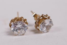 A pair of 9ct gold stud earrings set with cubic zirconium