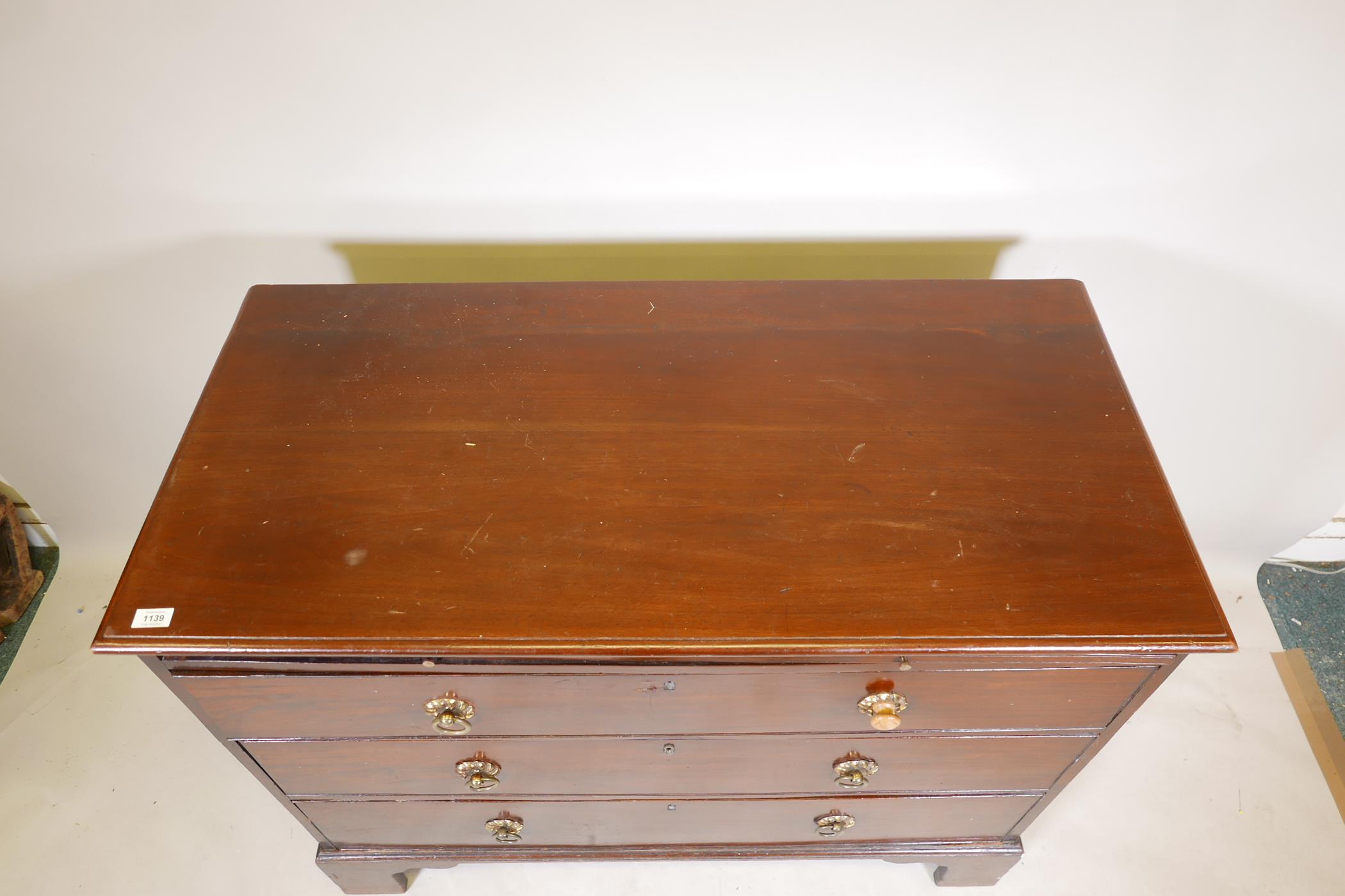 A C19th mahogany chest of three long drawers, under a brushing slide, raised on bracket supports, - Image 4 of 6