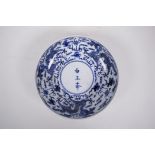 A Republic period blue and white porcelain bowl with three dragon decoration, three character