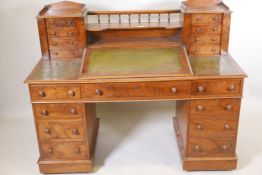 A Victorian walnut twin pedestal Dickens desk, with a three section tooled leather inset top, the
