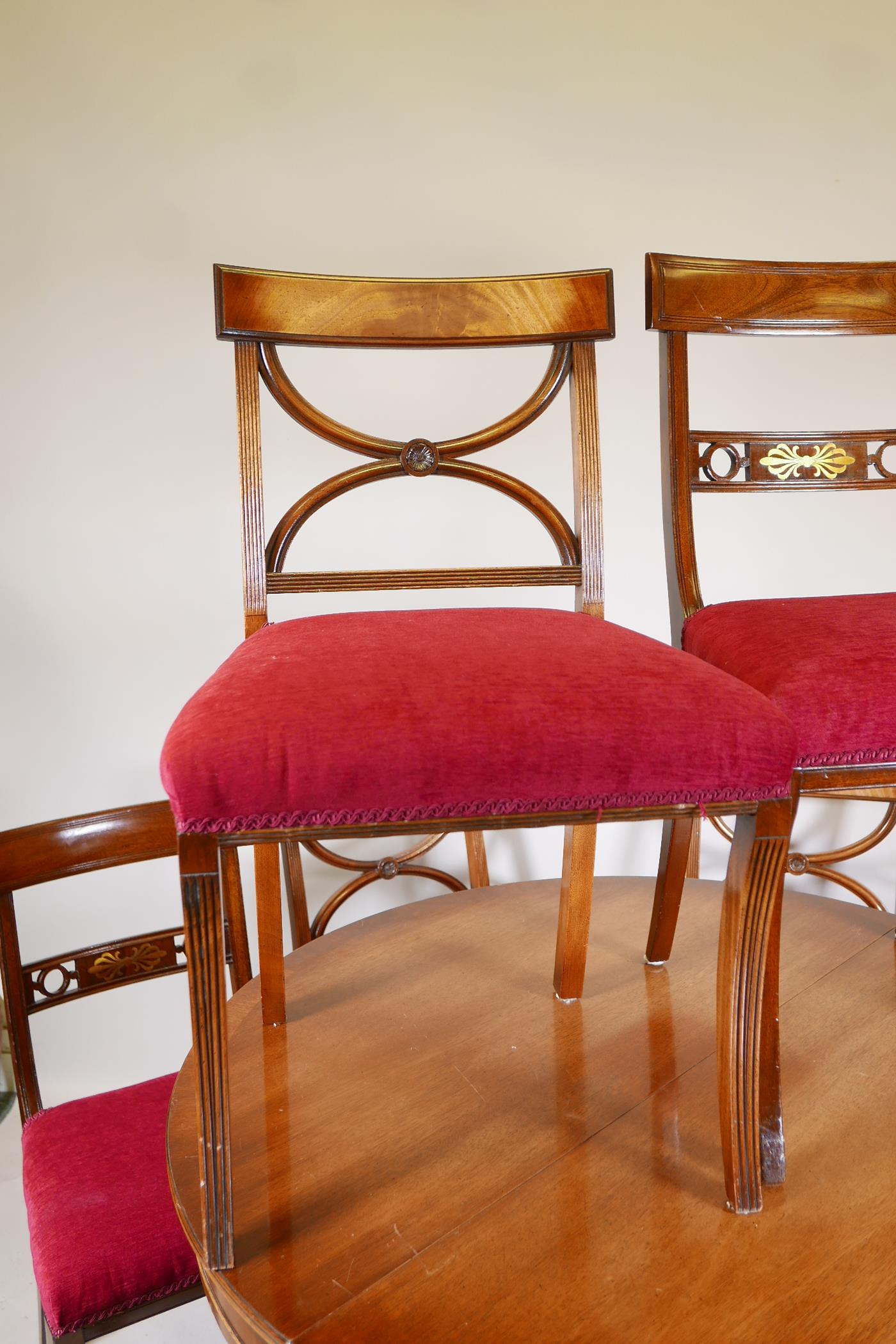 A mahogany drawleaf dining table with dummy drawer frieze, raised on a turned column and splay feet, - Image 4 of 6