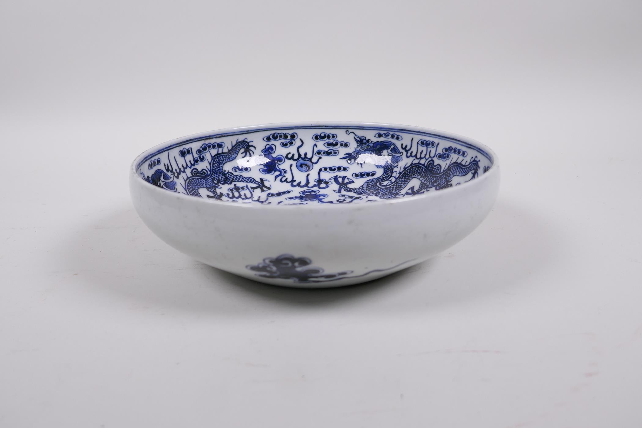 A Republic period blue and white porcelain bowl with three dragon decoration, three character - Image 2 of 5