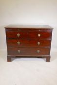 A C19th mahogany chest of three long drawers, under a brushing slide, raised on bracket supports,