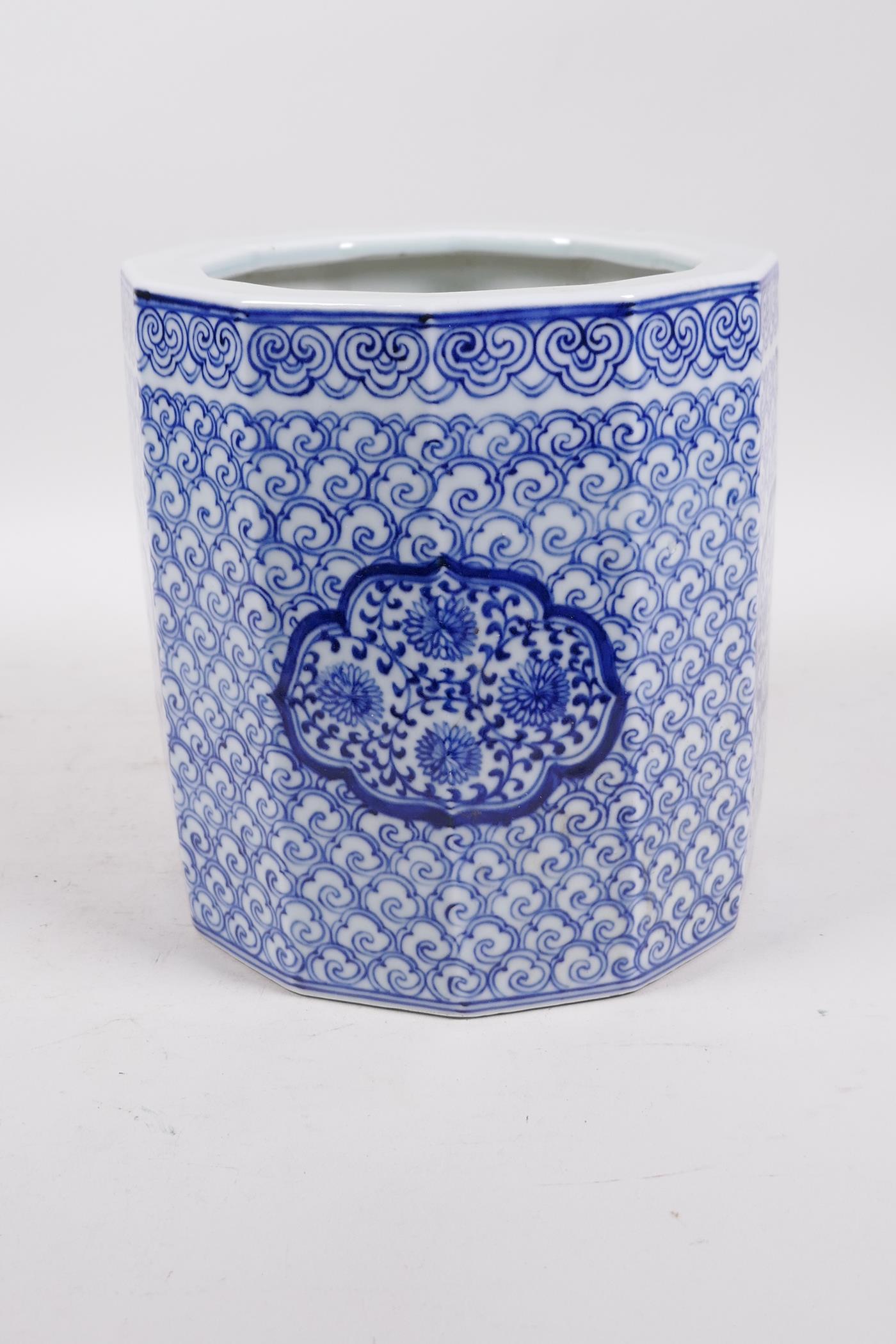 A Chinese Republic blue and white porcelain brush pot with decorative floral panels, 7" high x 7" - Image 4 of 5