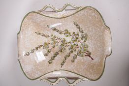 An Italian Deruta pottery fruit bowl with shaped rim, hand painted with flowering branches, 13" x