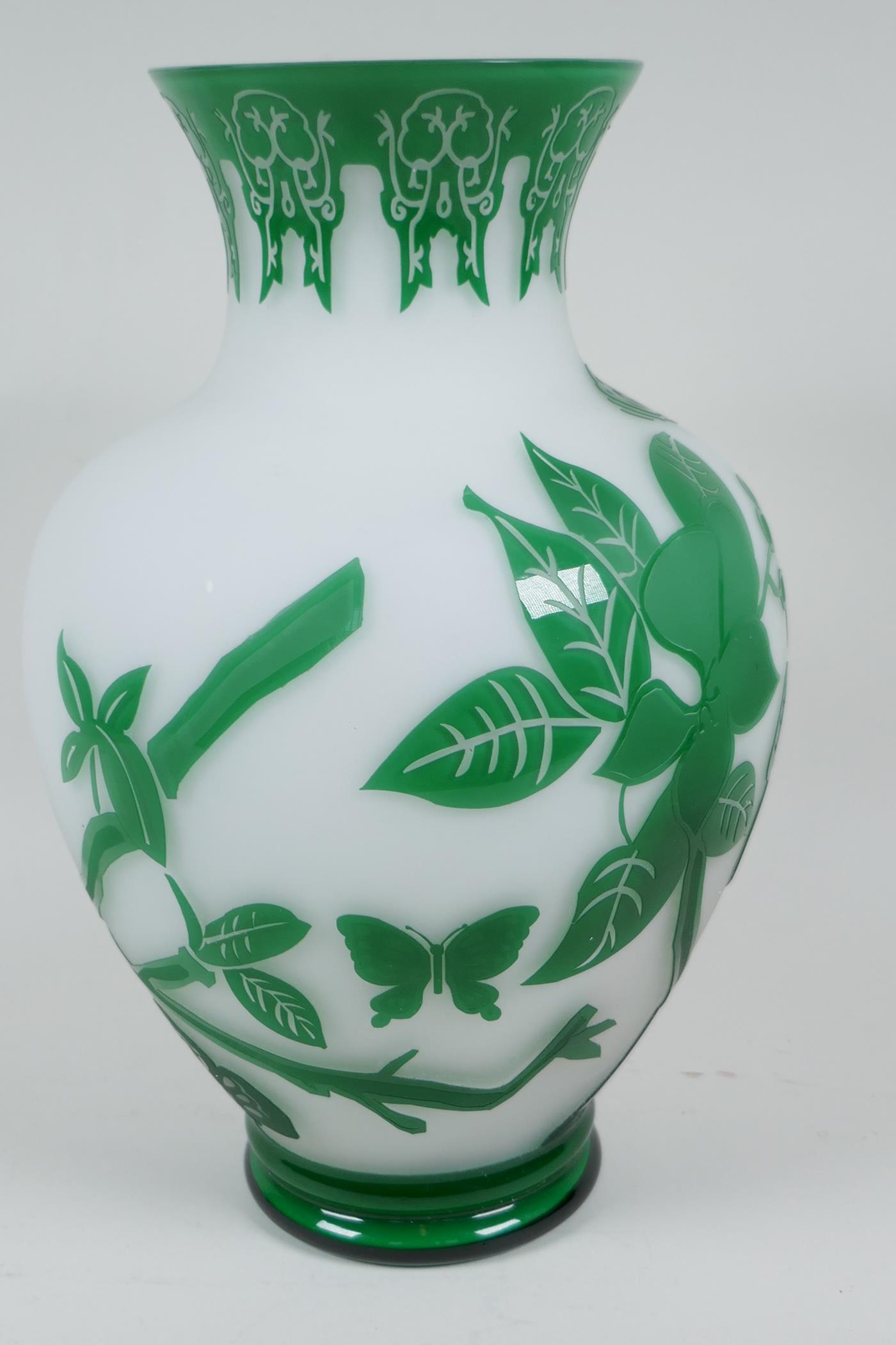 A Peking glass vase with cut green overlay over white, depicting butterflies and flowering branches, - Image 4 of 4