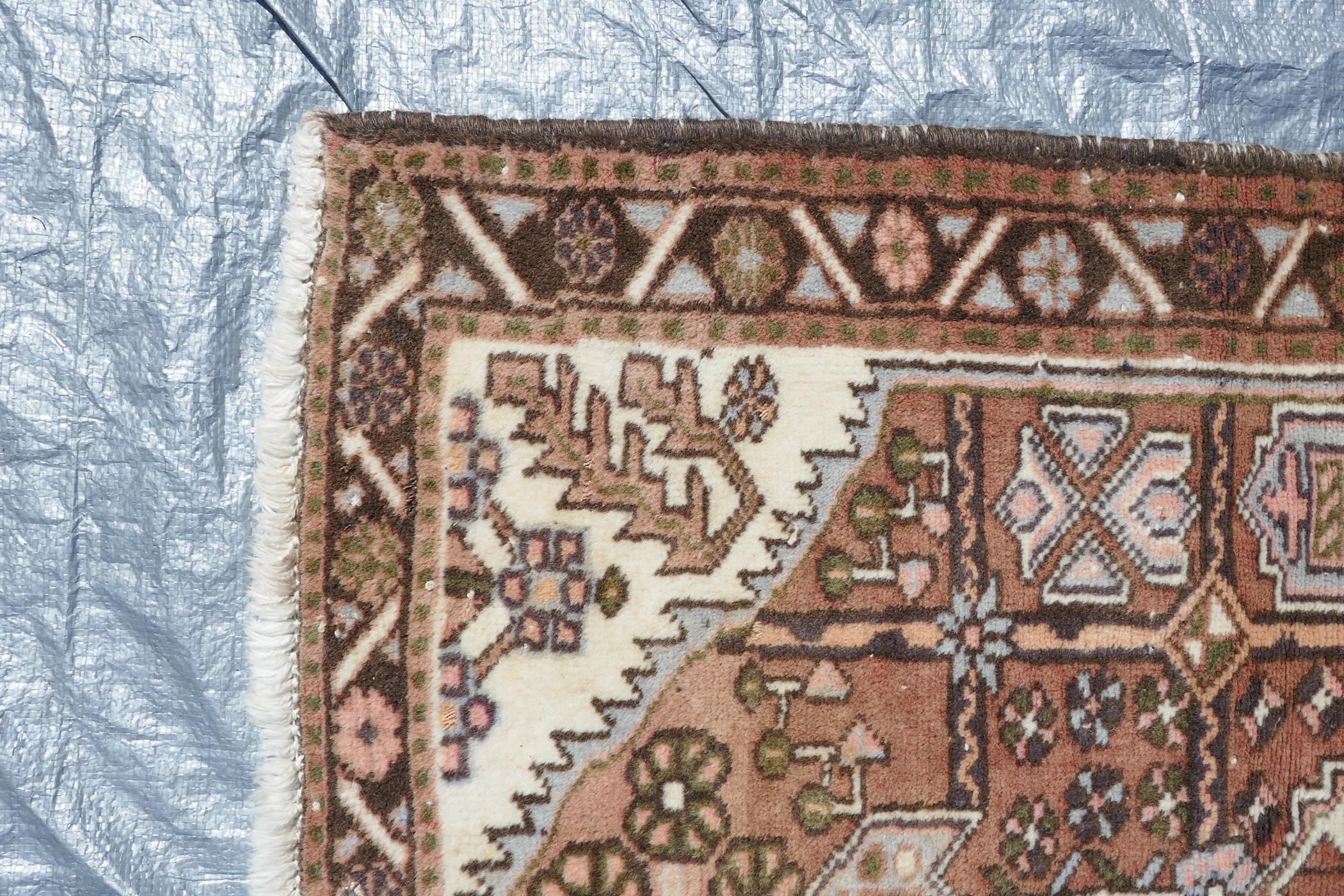 A Persian brown and cream ground wool prayer rug, with a geometric medallion design, 50" x 34" - Image 2 of 3