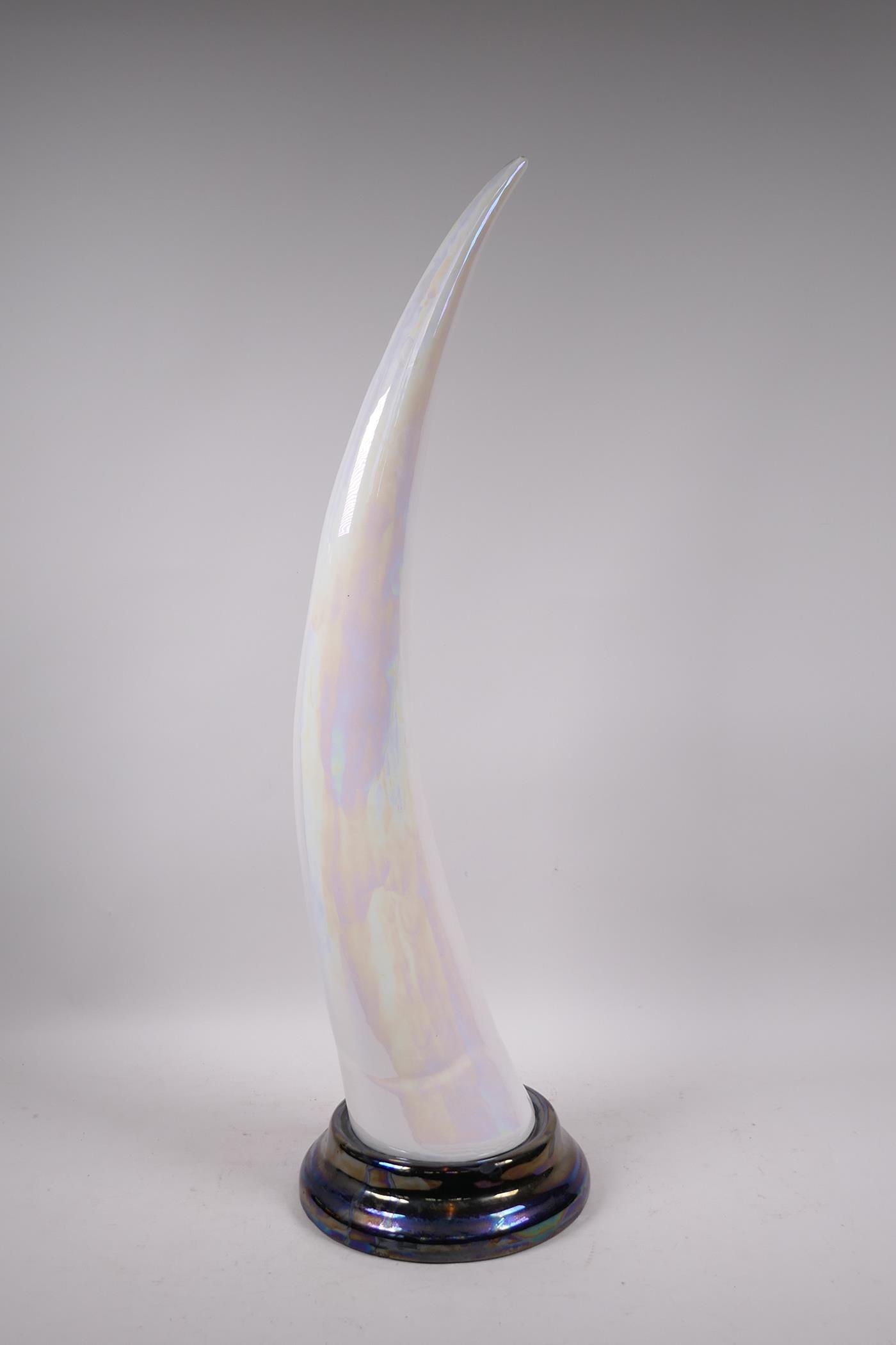 A lustre glazed ceramic tusk, 27½"