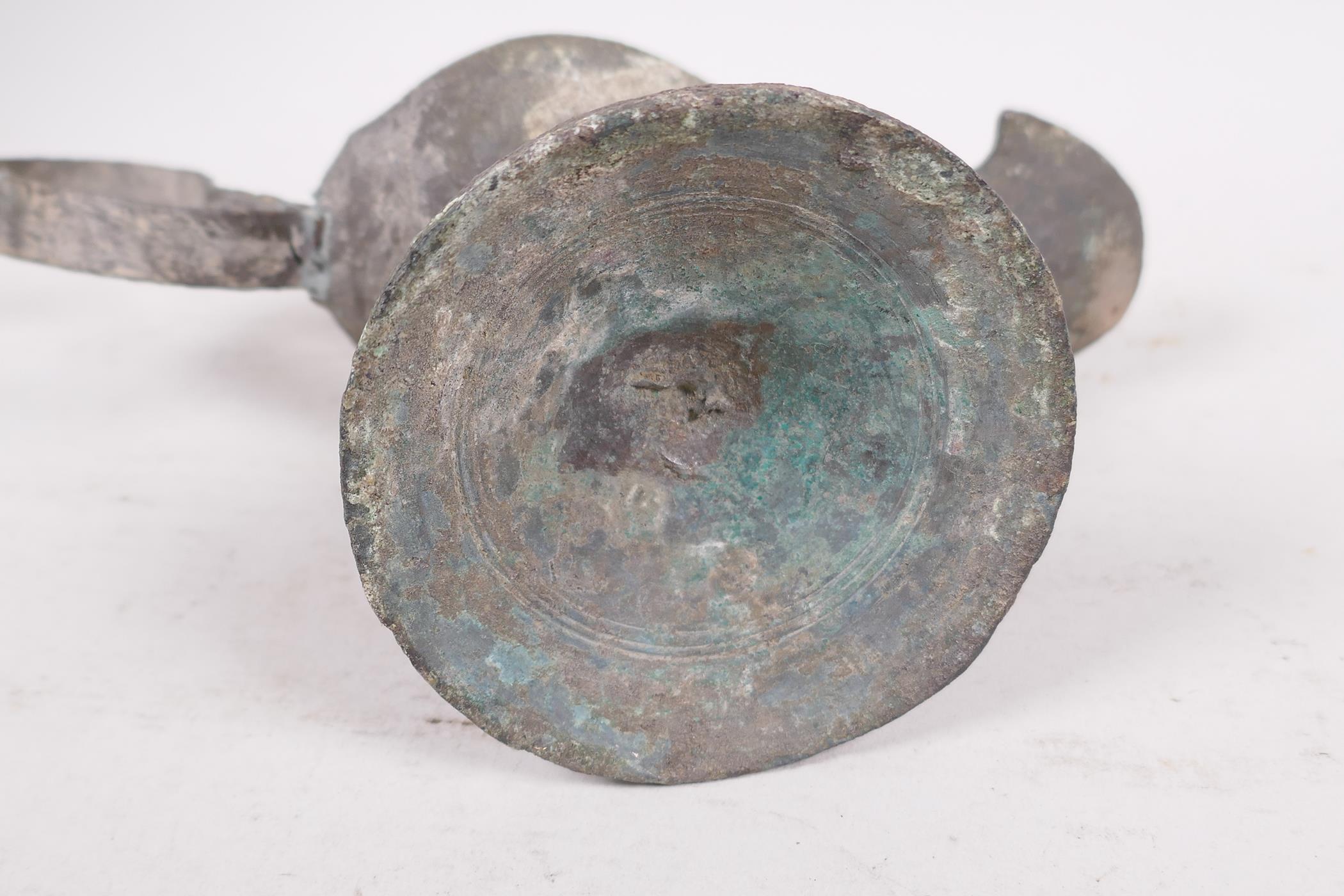 A Roman bronze oil lamp on pedestal base, 7" long - Image 4 of 4