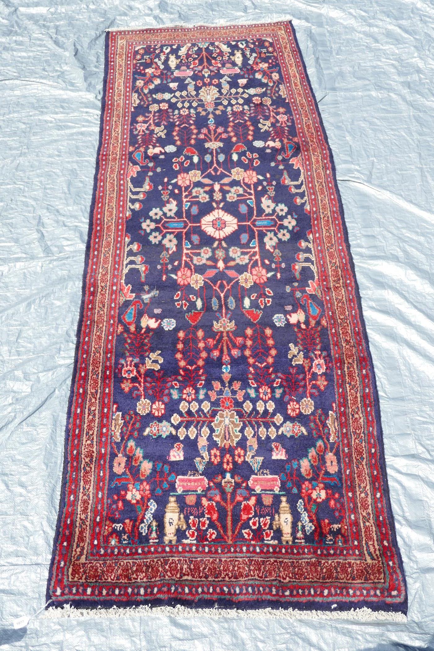 A rich blue ground full pile Persian Sarouk runner with an unique floral pattern, 122" x 41" - Image 2 of 8