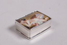 A sterling silver pill box, the lids set with an enamel plaque depicting a female nude