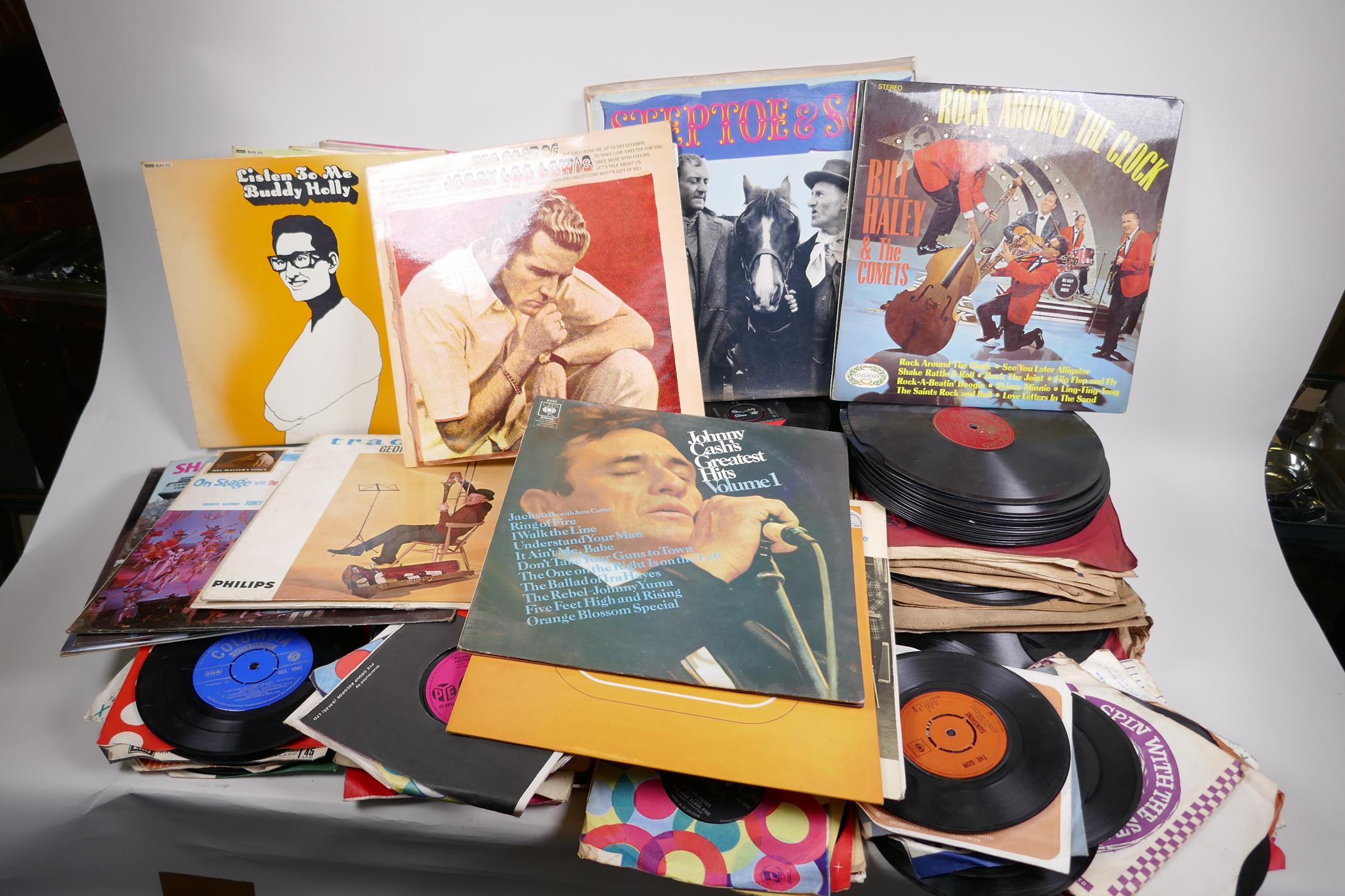 A quantity of records including LPs, 45s and 78s, featuring Buddy Holly, Gerry Lee Lewis etc