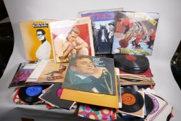 A quantity of records including LPs, 45s and 78s, featuring Buddy Holly, Gerry Lee Lewis etc