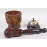 An antique French wooden mortar and pestle, mortar 4" high, and a reception desk bell