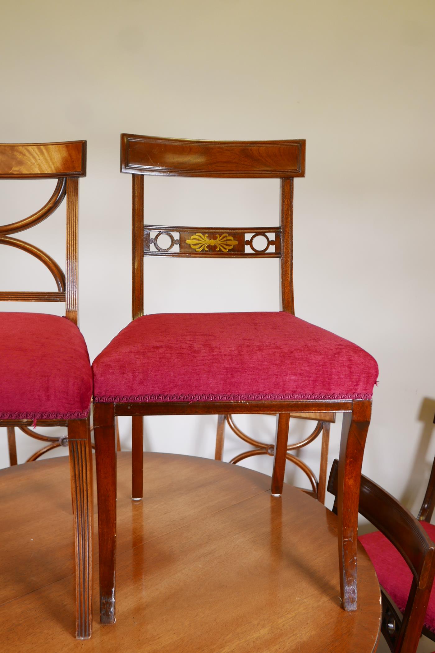 A mahogany drawleaf dining table with dummy drawer frieze, raised on a turned column and splay feet, - Image 3 of 6