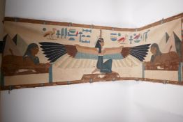 An Egyptian revival wall hanging depicting a winged deity and two sphinx, 57" x 18", A/F