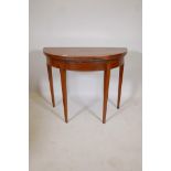 A C19th mahogany demi lune card table, raised on square tapering supports, 36" x 17" x 29"