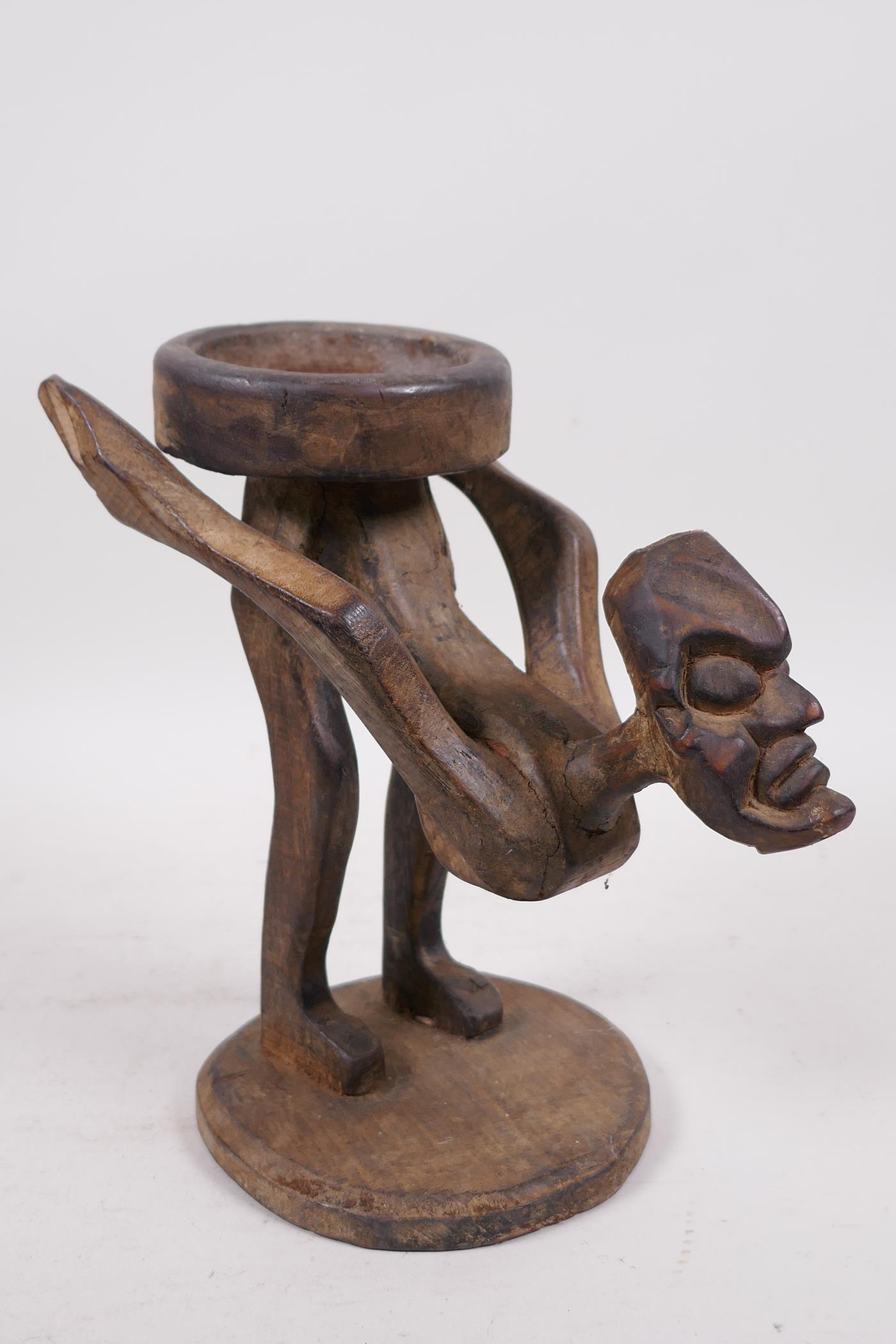 An unusual Indonesian wood figure carved as a stand, 9" high - Image 3 of 4