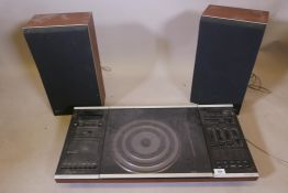 A Bang & Olufsen Beo-Centre 2002 with two Beovox S.30 speakers in rosewood cases