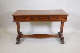 A Regency mahogany side table with three frieze drawers on ornate pierced end supports with