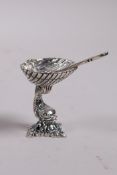 A 925 silver salt and spoon in the form of a clam shell held aloft by a fish, 1½"