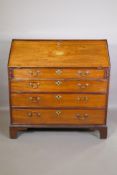 George III inlaid mahogany fall front bureau with fitted interior over four long drawers with
