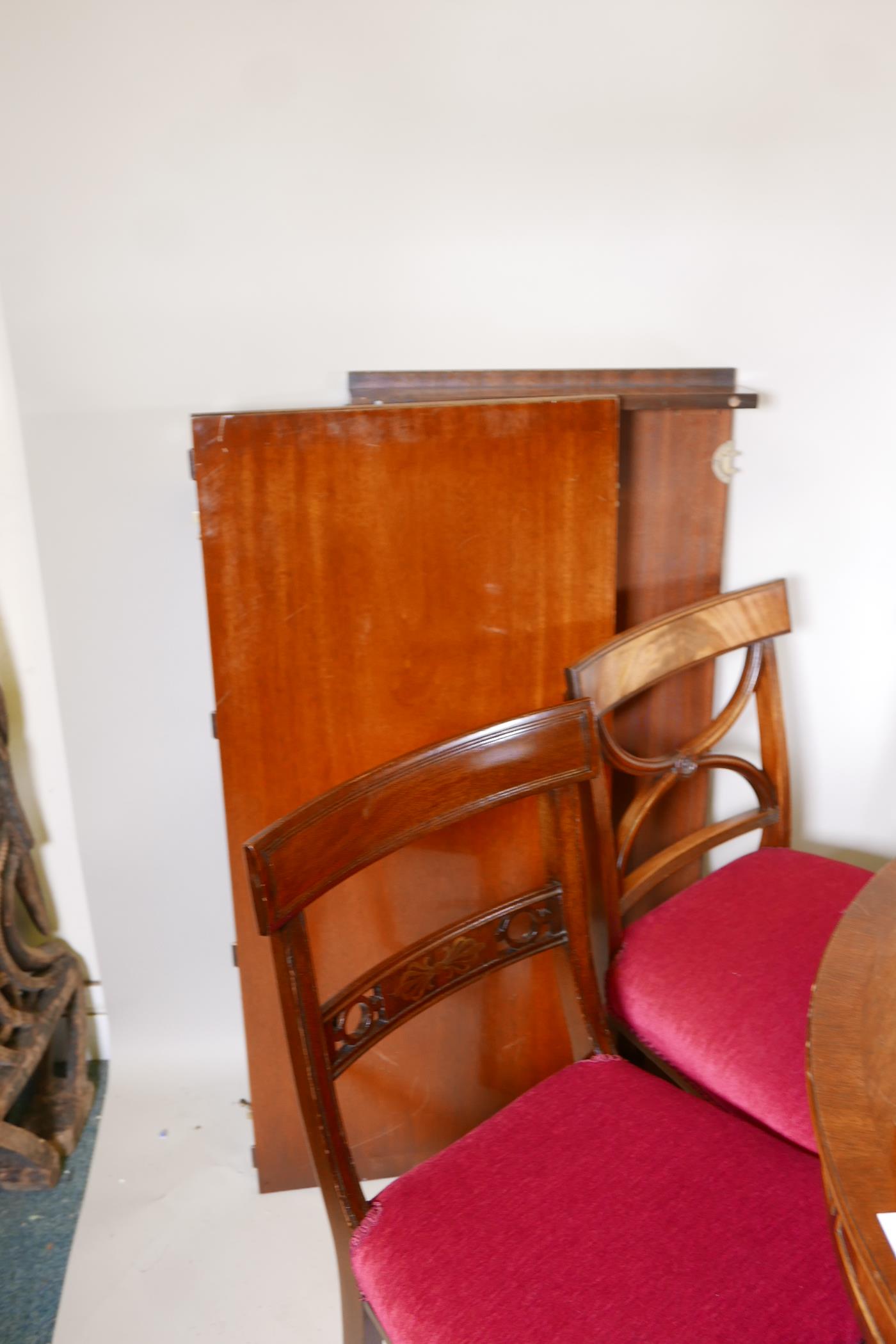 A mahogany drawleaf dining table with dummy drawer frieze, raised on a turned column and splay feet, - Image 6 of 6