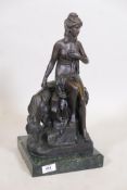 A bronze figure of a nude woman with a goat, after Jaques Limousin, mounted on a marble base, 17"