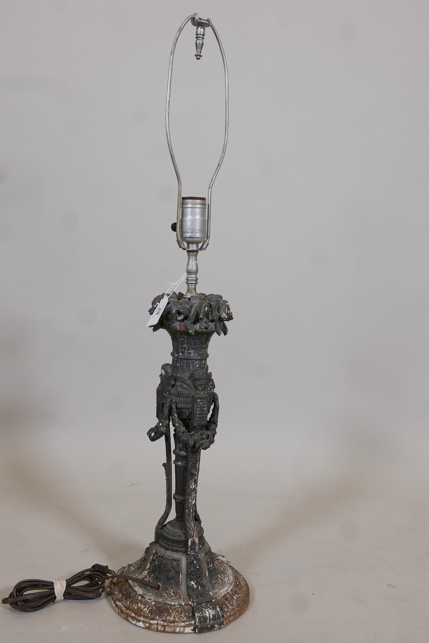 A C19th wood table lamp, well carved with floral swags and winged putti, drilled for electricity, - Image 4 of 4