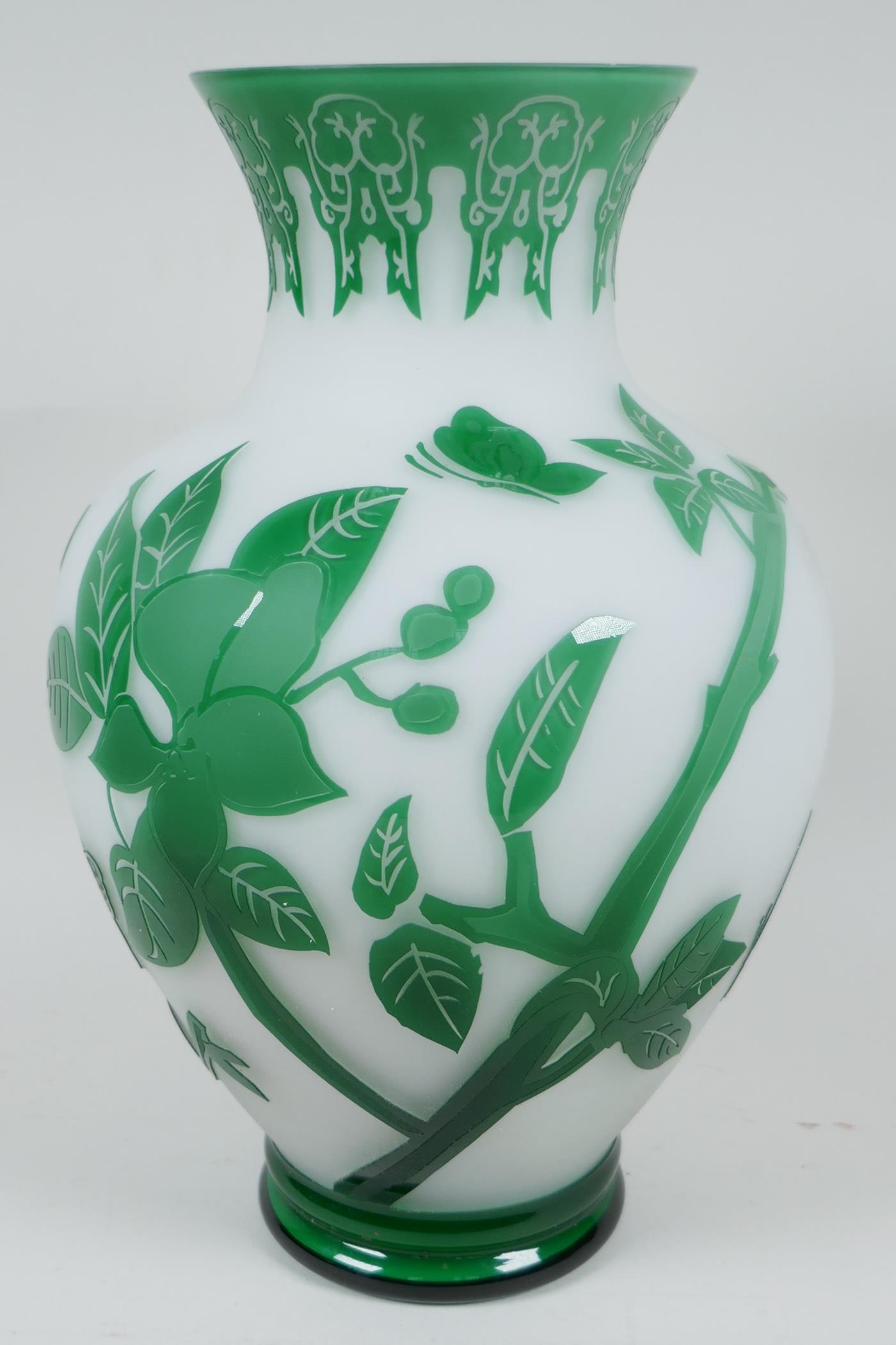 A Peking glass vase with cut green overlay over white, depicting butterflies and flowering branches, - Image 3 of 4