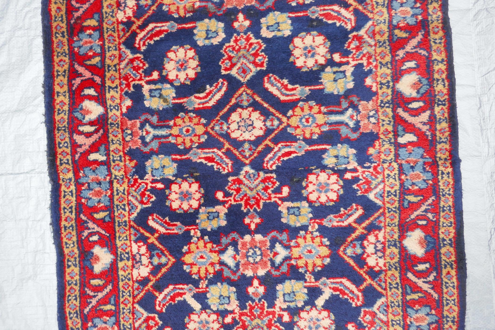 A blue ground Persian Sarouk runner with all over design and red borders, 33" x 140" - Image 5 of 8