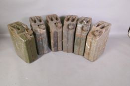Six 1940s and 50s Jerry cans, five gallons each, some WD stamps, 18" high