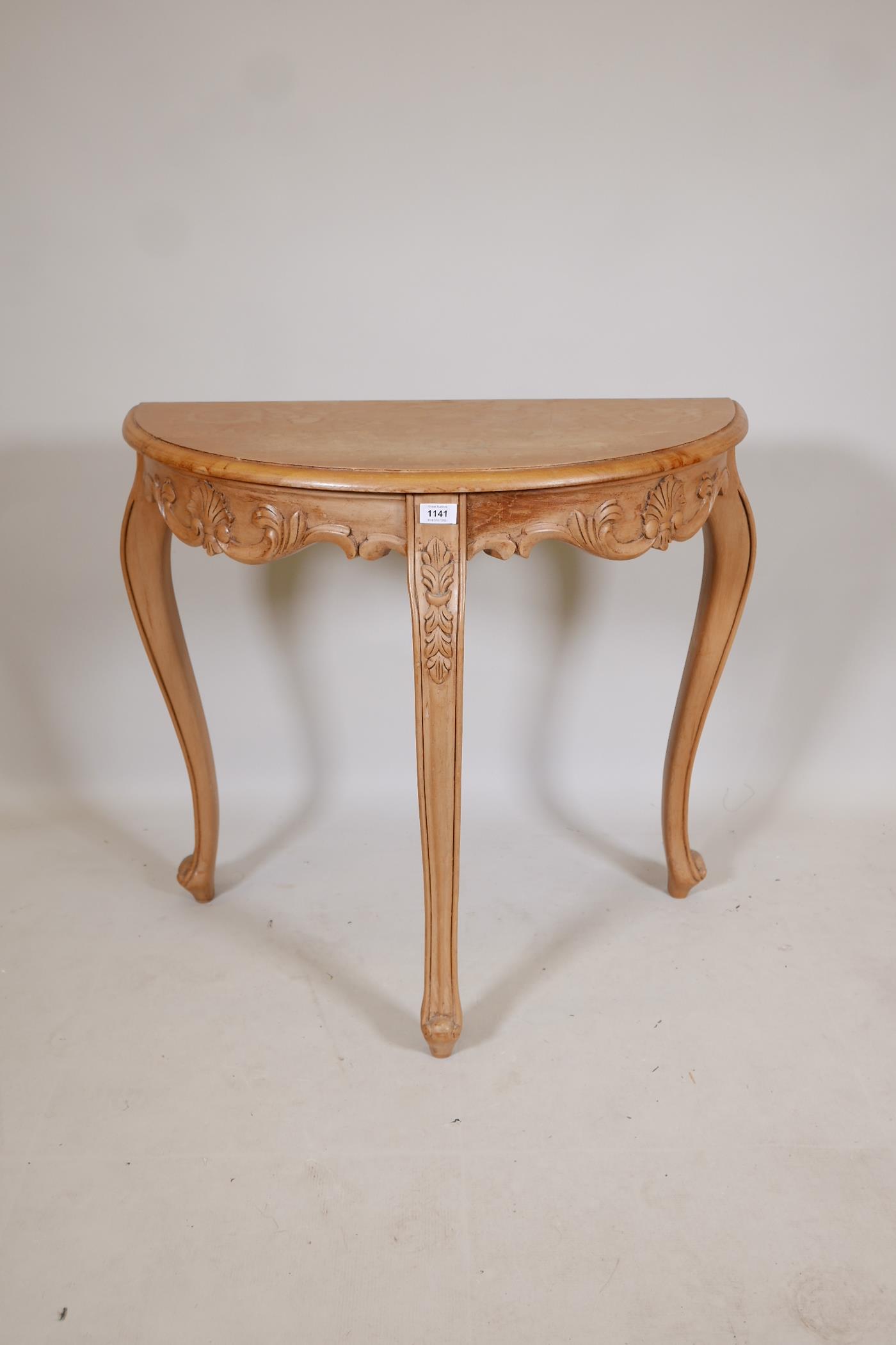 A pine demi lune console table, with carved frieze, raised on cabriole supports, 32" x 16" x 30"