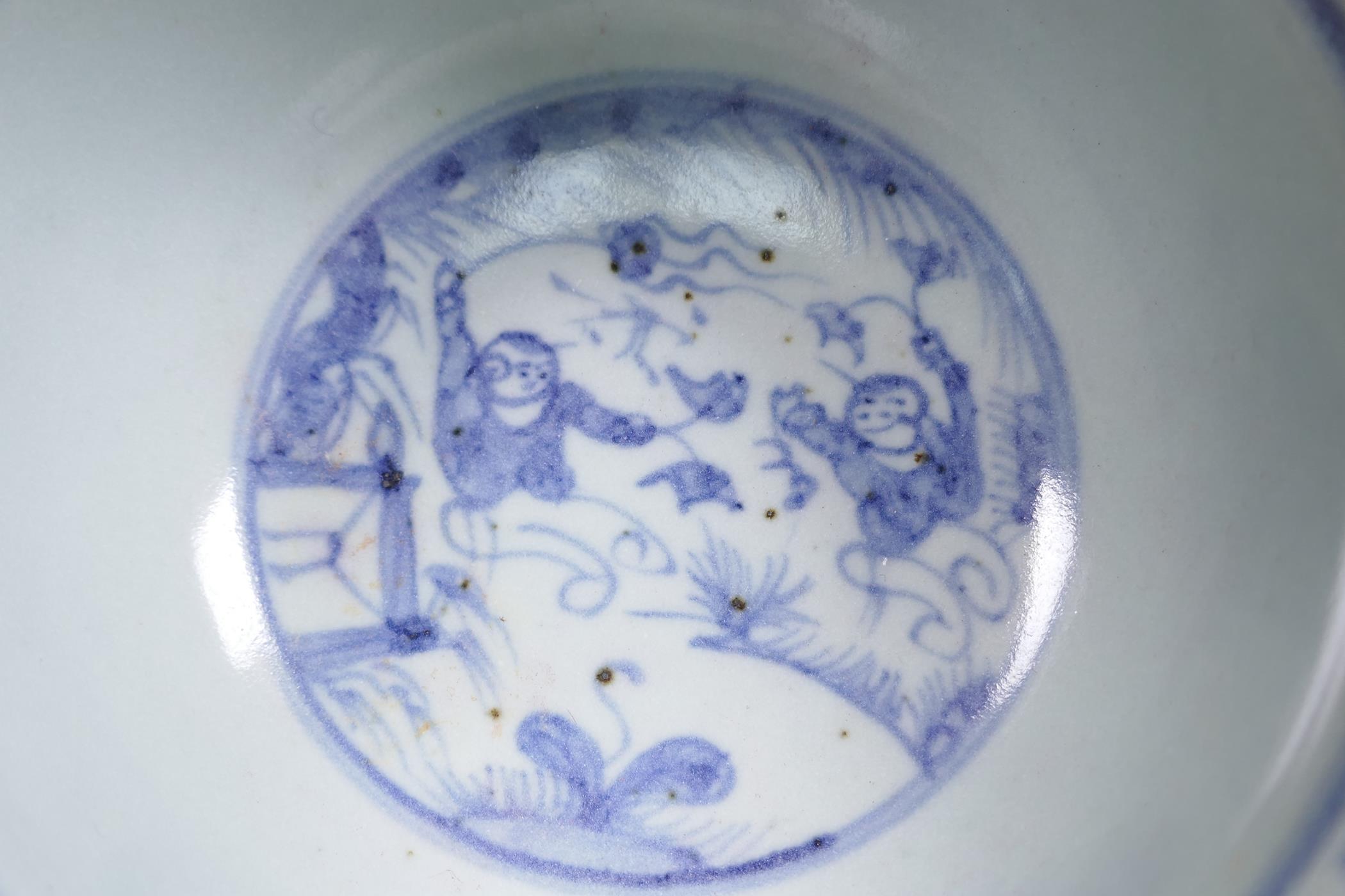 A blue and white porcelain rice bowl, decorated with boys playing in a landscape, 5½" diameter - Image 4 of 5