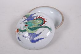 A Chinese Republic porcelain circular box and cover with enamelled dragon and flaming pearl