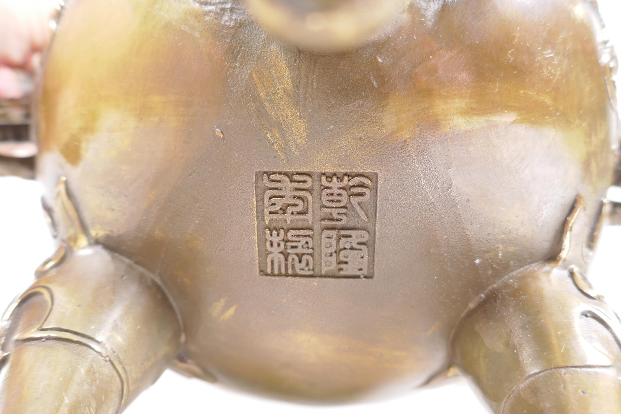 A Bronze Chinese dragon censer and cover with two handles and a fo dog knop, raised on tripod - Image 6 of 6