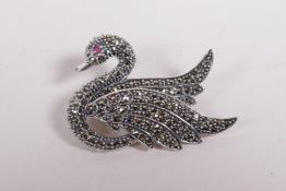 A 925 silver and marcasite set brooch in the form of a swan, 2½" wide