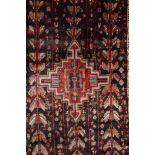 A multicoloured ground Iranian village rug with a bespoke all over design, 116" x 55"