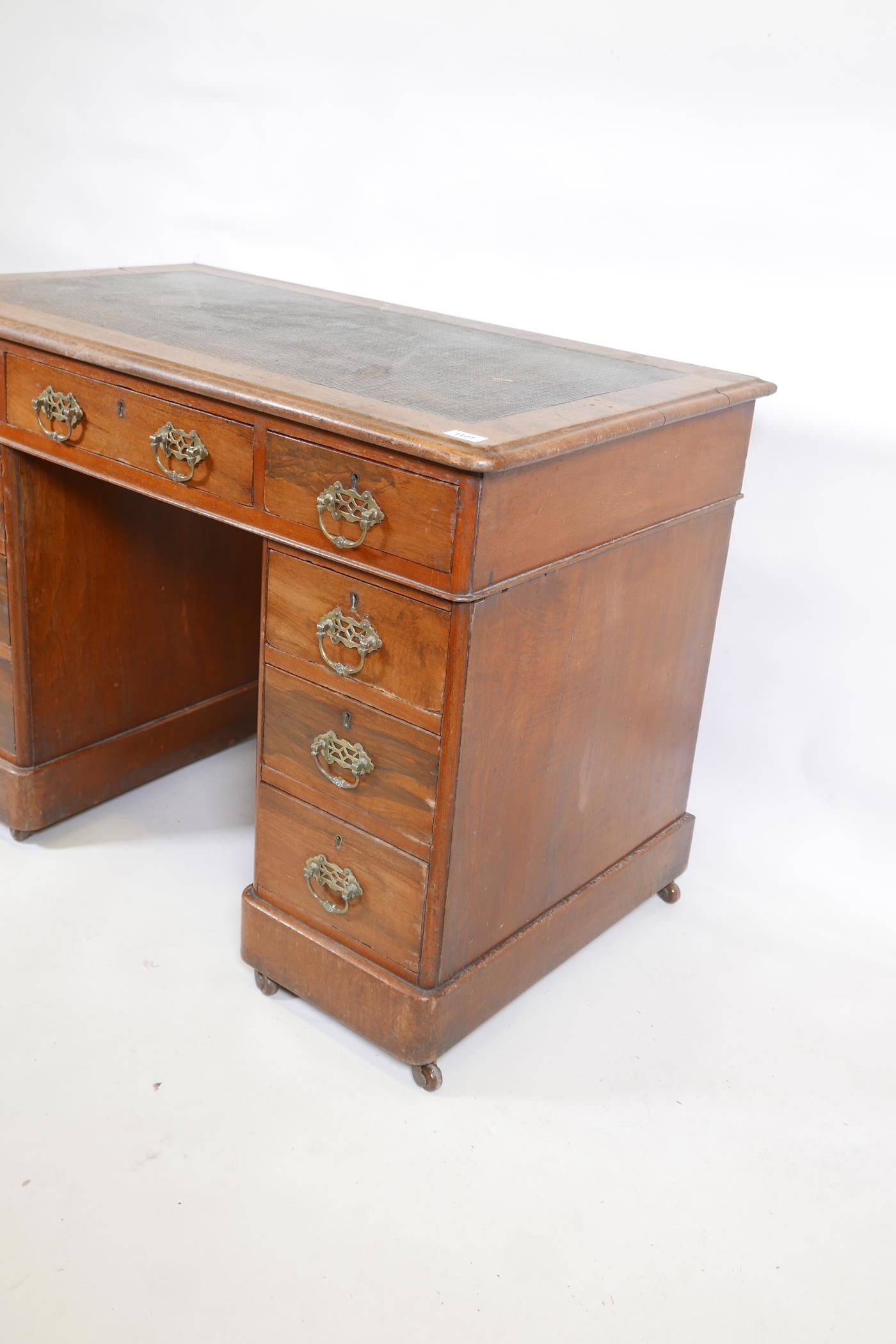 A Victorian walnut pedestal desk with an inset faux leather top and nine drawers, 40" x 23", 27" - Image 4 of 6