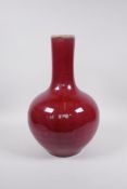 A Chinese sang de boeuf glazed pear shaped vase, 6 character mark to base, 13½"