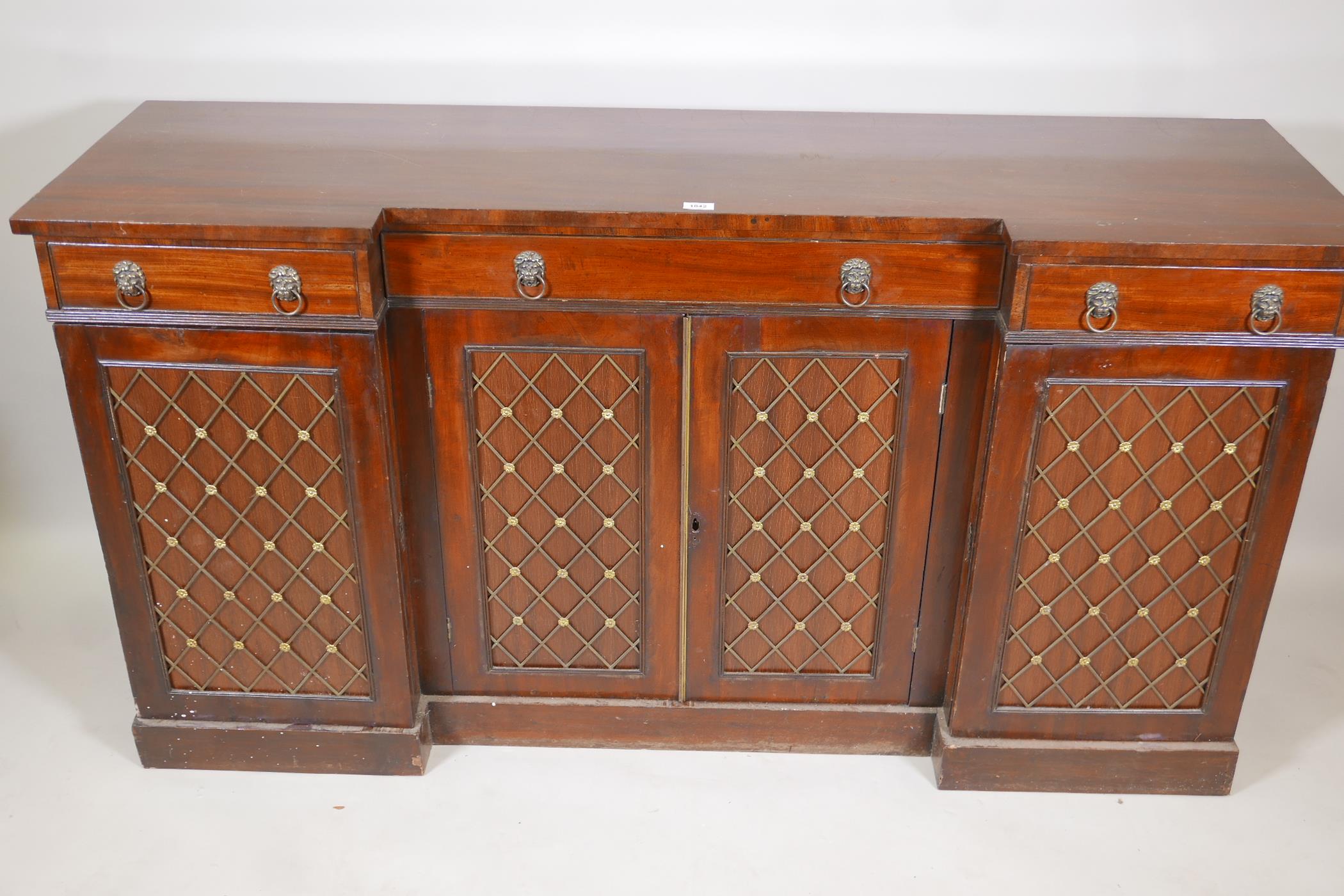 A Regency mahogany breakfront sideboard, the four doors fitted with brass grills, raised on a plinth - Image 2 of 2