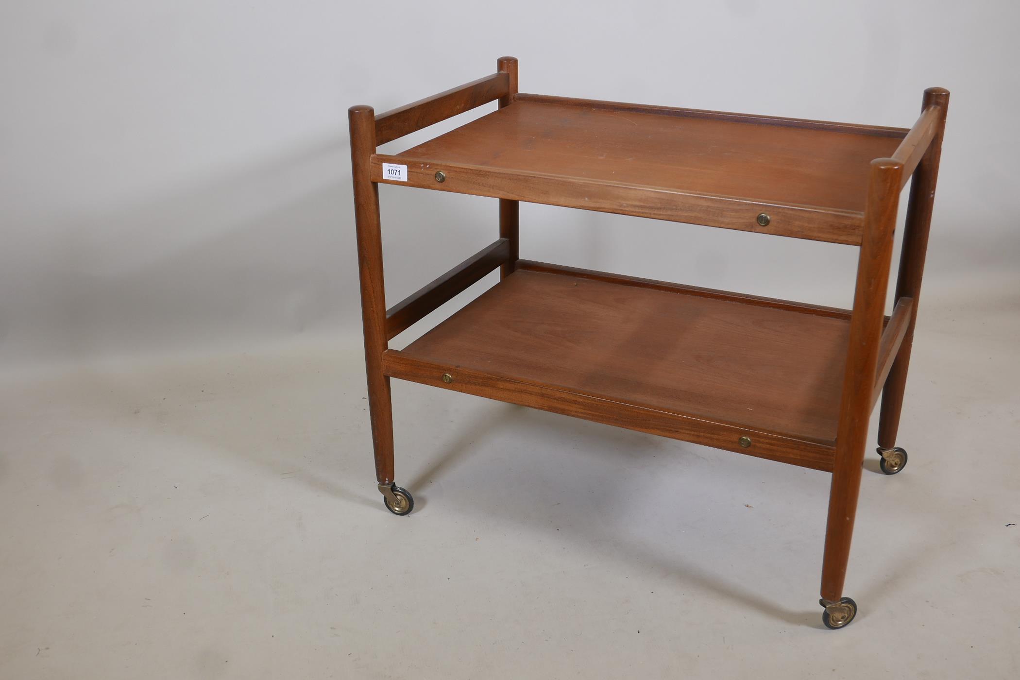 A 1970s teak two tier hostess trolley, 28" x 19" x 25" high