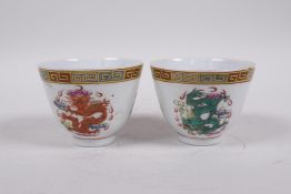 A pair of Chinese polychrome enamelled porcelain tea bowls with dragon decoration, circa early